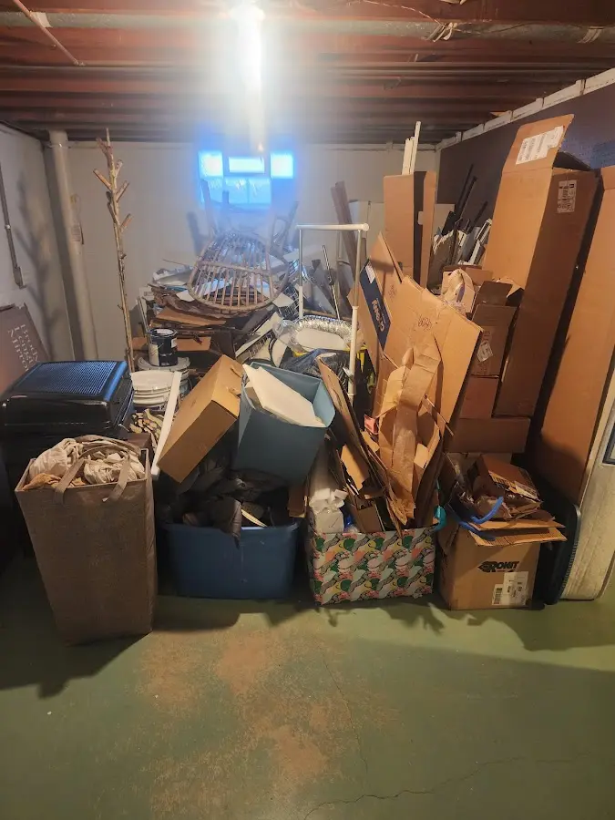 Roll-off dumpster container at job site for 2 Yard Dumpster Rental in Thompson's Station